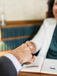 Woman shaking hands with business partner